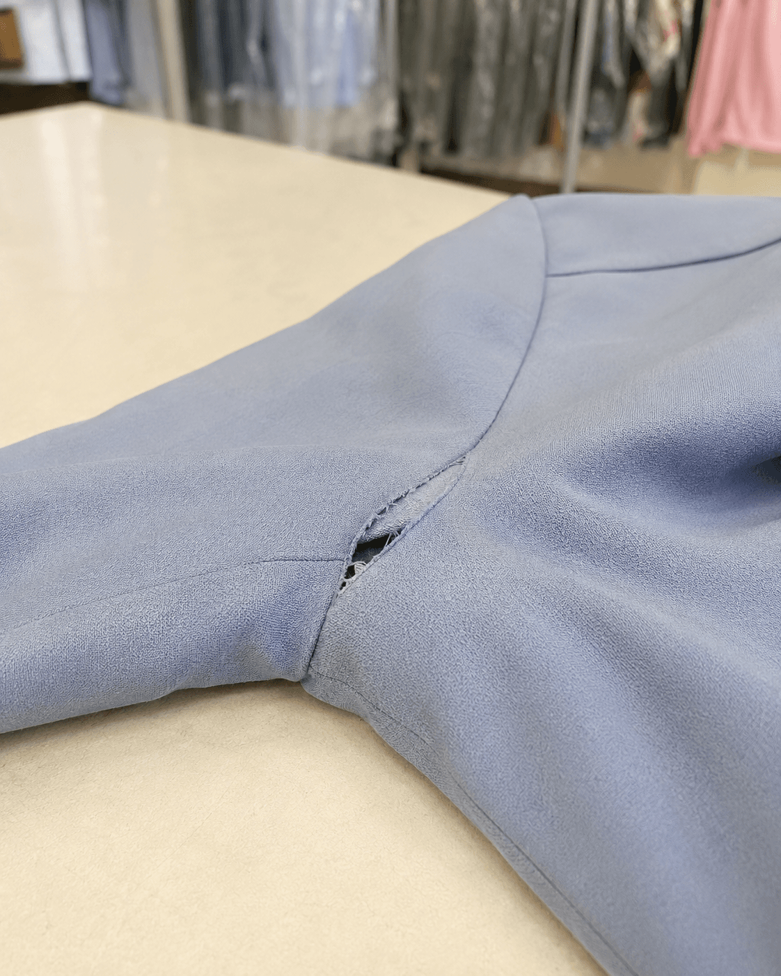 Loose sleeve seam before alteration repair